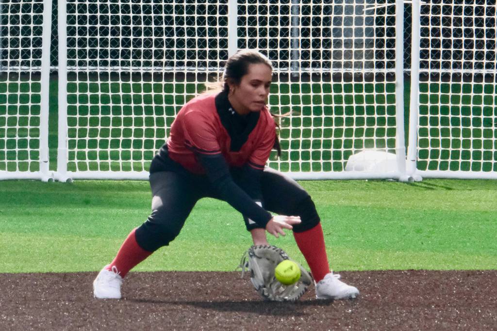 Juneau-Douglas High School: Yadaa.at Kalé senior Bryanna Eakes fields a ball in center field during the Crimson Bears 12-6 win over the West Valley Wolfpack on Saturday at Adair Kennedy Park. (Klas Stolpe / Juneau Empire).
