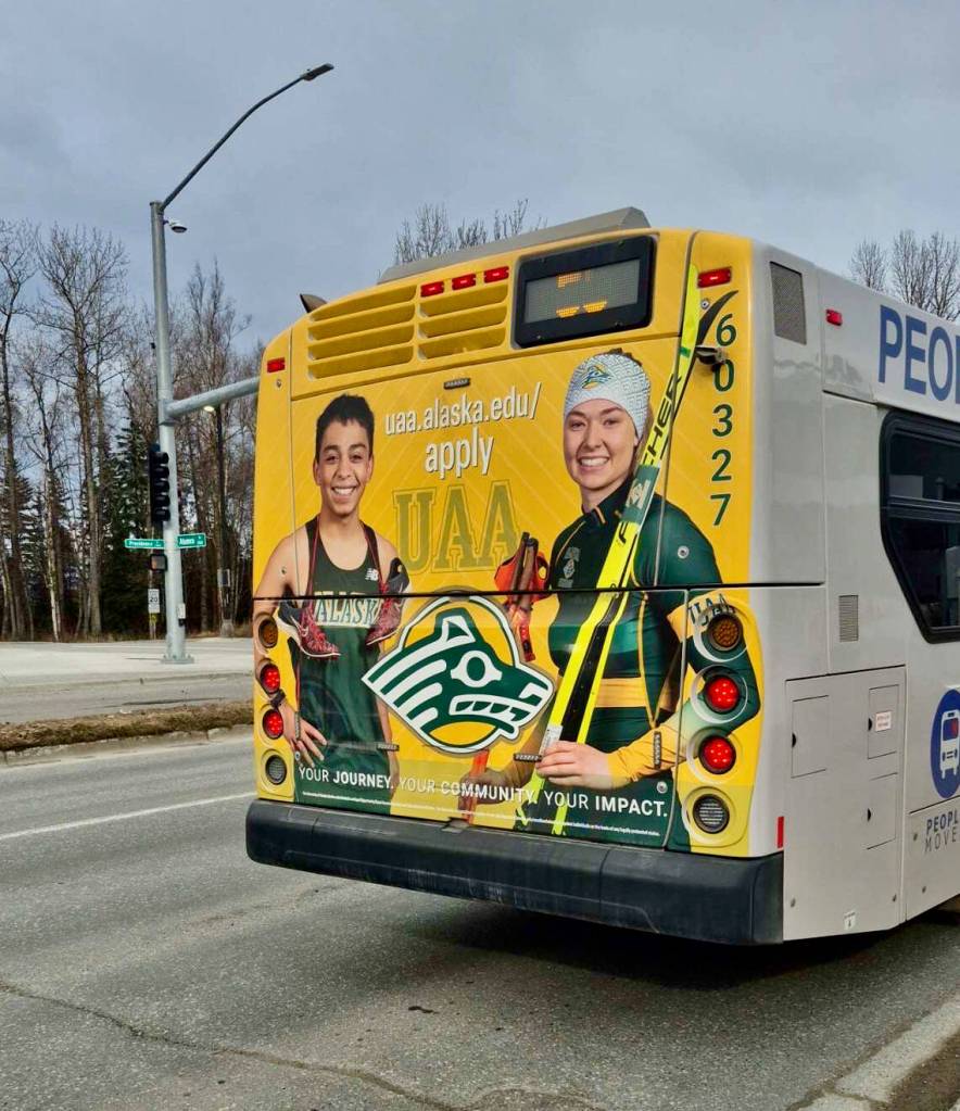 University of Alaska Anchorage freshmen Edgar Vera-Alvarado, a Juneau-Douglas High School: Yadaa.at Kalé 2024 graduate, and Marit Flora, a 2023 Service High School graduate, have their images on an Anchorage People Mover bus. Vera-Alvarado is on the Seawolves cross-country and track teams and Flora is on the Nordic ski team. (Photo courtesy Edgar Vera-Alvarado)