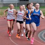 Sitkas Marina Dill leads the girls 3,200 during the Capital City Invitational on Friday. At far left is Juneau-Douglas High School: Yadaa.at Kalé freshman Sigrid Eller and junior Siena Farr. (Klas Stolpe / Juneau Empire)