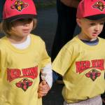 Gastineau Channel Little League youth players hold hands as they find their teams during Saturdays Opening Day, and field grand reopening and rededication at Adair Kennedy Memorial Park. (Klas Stolpe / Juneau Empire)