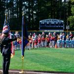 The Juneau Police Honor Guard render a salute during the National Anthem at Saturdays Gastineau Channel Little League Opening Day and field grand reopening and rededication at Adair Kennedy Memorial Park. (Klas Stolpe / Juneau Empire)