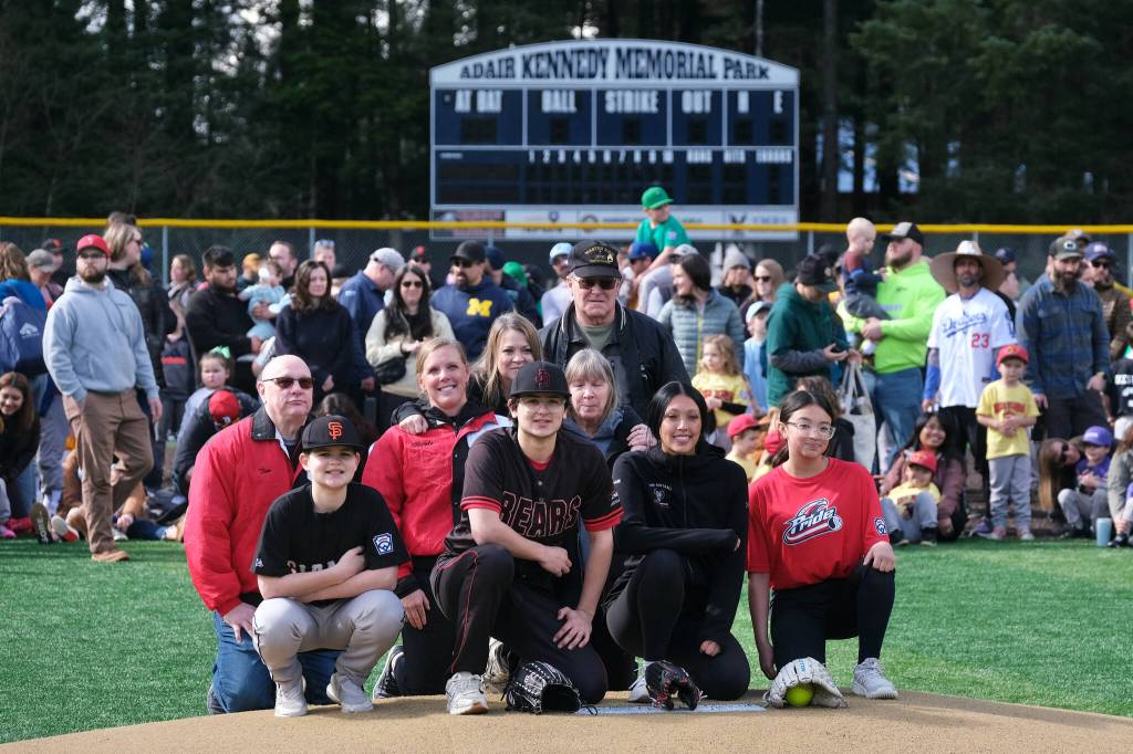 Family members of Adair Kennedy Memorial Park namesake Richard Adair pose during Saturdays Gastineau Channel Little League Opening Day, and field grand reopening and rededication at Adair Kennedy Memorial Park. (Klas Stolpe / Juneau Empire)