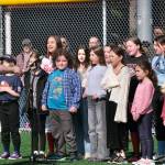 The Juneau Youth Choir sings the National Anthem during Saturdays Gastineau Channel Little League Opening Day, and field grand reopening and rededication at Adair Kennedy Memorial Park. (Klas Stolpe / Juneau Empire)
