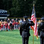 The Juneau Police Honor Guard render a salute during the National Anthem at Saturdays Gastineau Channel Little League Opening Day, and field grand reopening and rededication at Adair Kennedy Memorial Park. (Klas Stolpe / Juneau Empire)