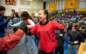 High school junior Jubilee Lewis is all smiles as she and other Mt. Edgecumbe High School Yupik Dancers take the stage at the BJ McGillis Gym to teach a dance to members of high school student governments from across Alaska on Thursday. (James Poulson / Daily Sitka Sentinel)