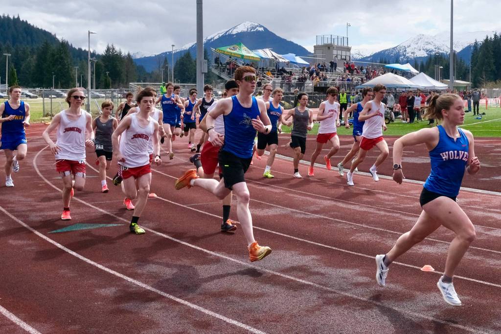 Sitka girls runner Clare Mullin joins and leads the start of the double stacked boys 1600 during Saturdays Capital City Invitational Track and Field meet at Juneaus Thunder Mountain Middle School field. Mullins time was registered to the girls race and placed first. (Klas Stolpe / Juneau Empire)