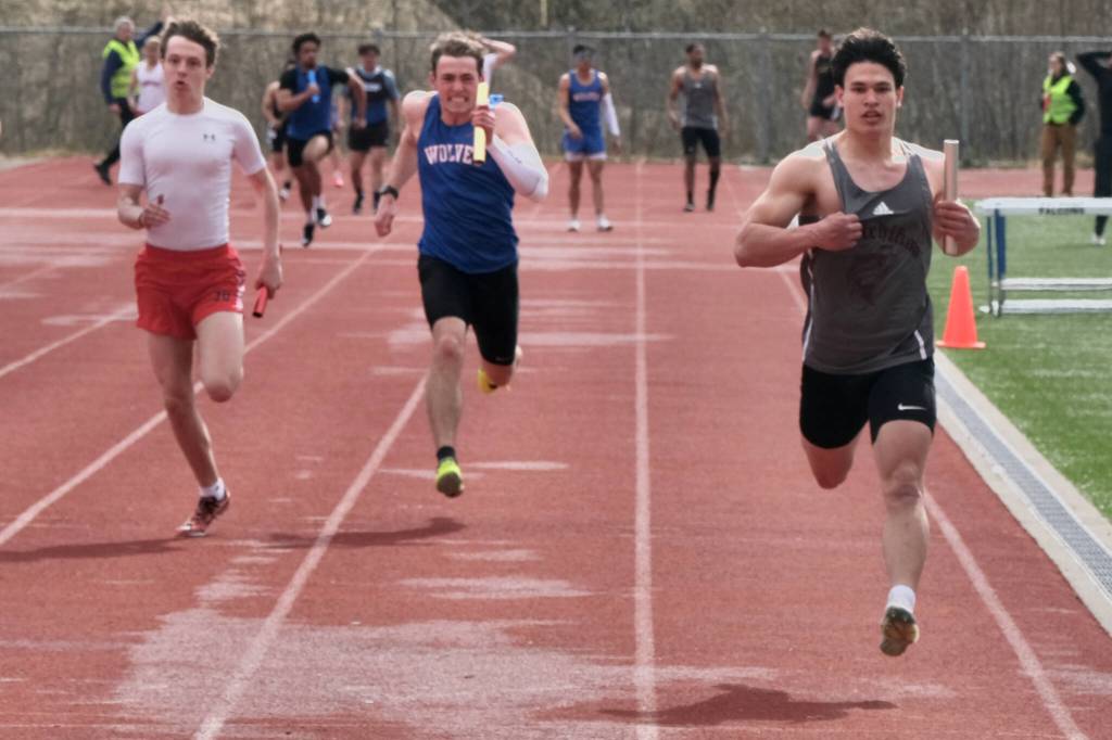 Ketchikan senior Jason Lorig finishes the anchor leg of the boys 4x100 as JDHS senior Carter Harralston and Sitka junior Calder Prussian sprint for second place during Saturdays Capital City Invitational Track & Field meet at Juneaus Thunder Mountain Middle School field. (Klas Stolpe / Juneau Empire)