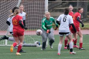 In this file photo JDHS junior keeper Alba Muir defends the goal against West Valley. Muir earned the Crimson Bears Hard Hat award for her play in Fridays road game against Colony. (Klas Stolpe / Juneau Empire file photo)