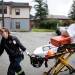 Capital City Fire/Rescue firefighter Jenna Habig transports a hospital gurney in an undated photo. (Photo courtesy of Jesse Inman)