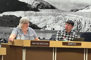 Juneau Mayor Beth Weldon and Deputy Mayor Greg Smith discuss the citys proposed budget for next year during a pair of meetings by Assembly members Wednesday night at City Hall. (Mark Sabbatini / Juneau Empire)
