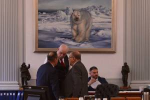 The chairs of the Senate Finance Committee huddle for a discussion after introducing their draft operating budget, Thursday, April 24, 2025. (James Brooks/Alaska Beacon)