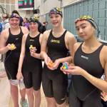 Glacier Swim Club swimmers Cora Soboleff, Katya Foy, Annabelle Woodruff and Madeline Rose Manlulu hold their heat winning ducks during the Alaska Swimming State Championships last weekend in Anchorage. (Photo courtesy GSC)