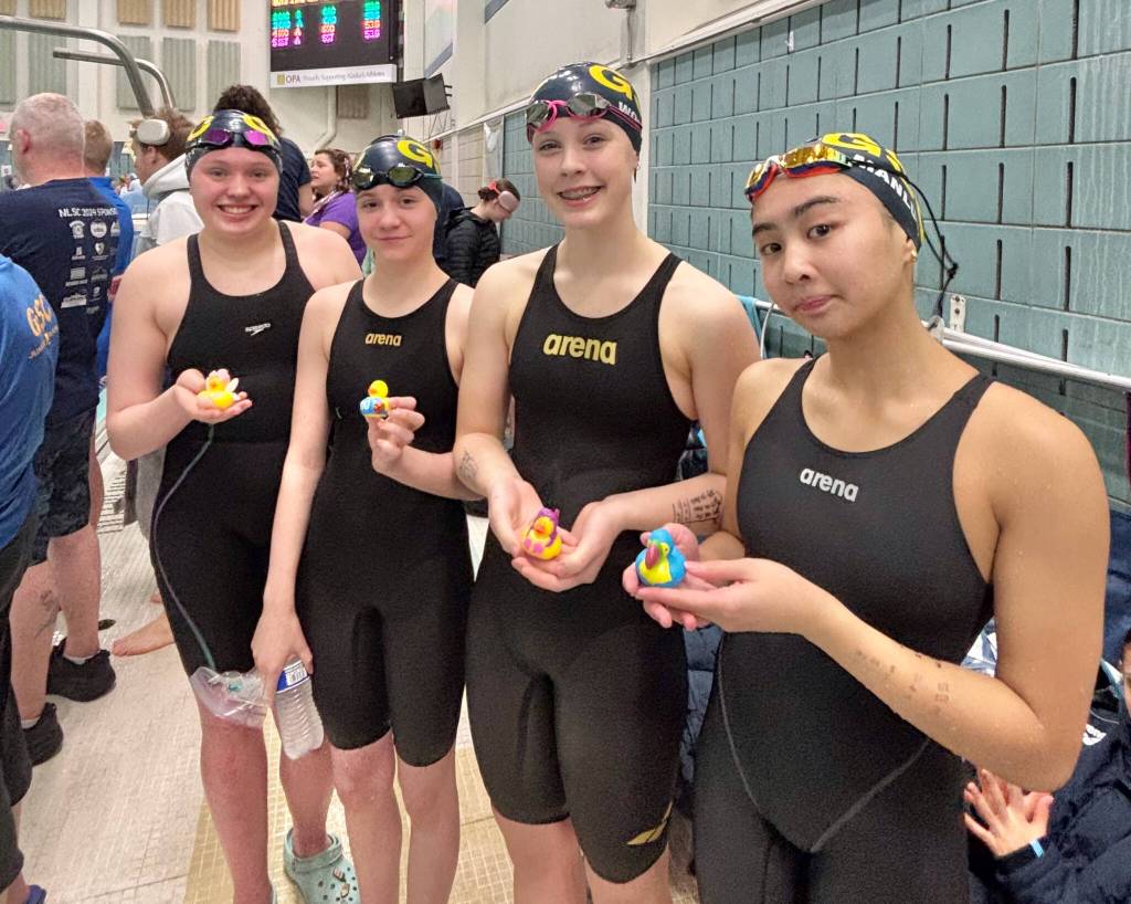 Glacier Swim Club swimmers Cora Soboleff, Katya Foy, Annabelle Woodruff and Madeline Rose Manlulu hold their heat winning ducks during the Alaska Swimming State Championships last weekend in Anchorage. (Photo courtesy GSC)