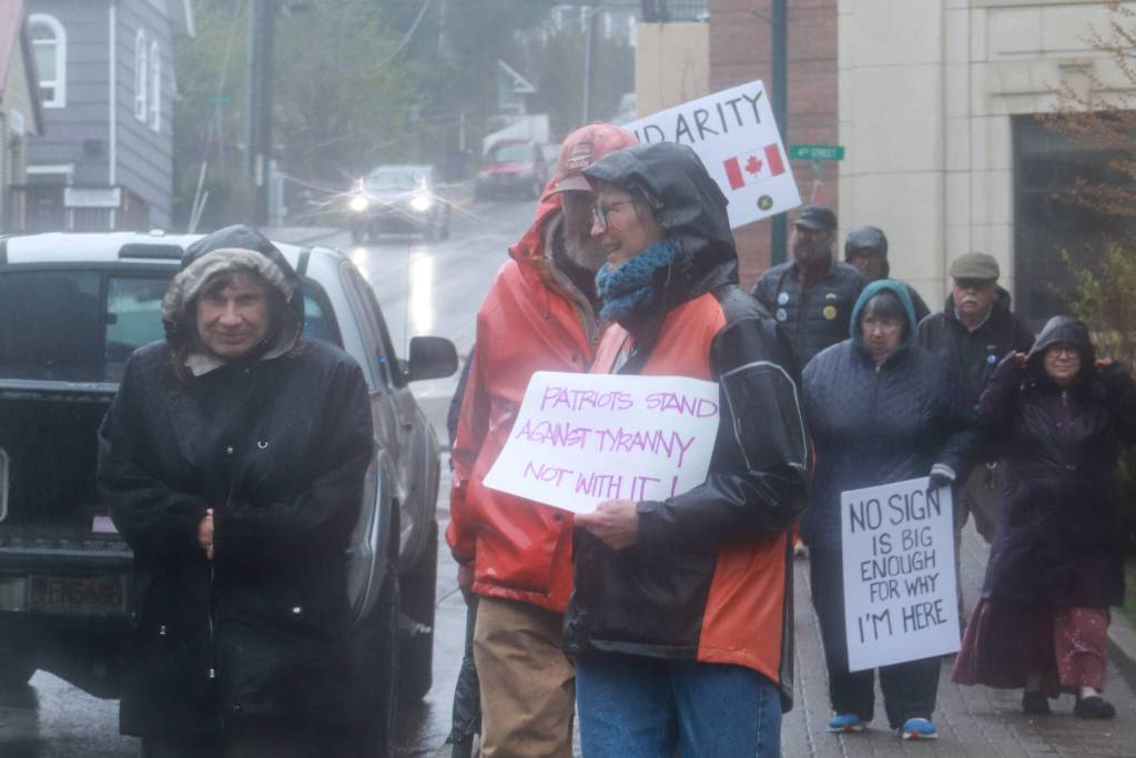 Protesters march to Marine Park after the May Day rally on Thursday, May 1, 2025. (Jasz Garrett / Juneau Empire)