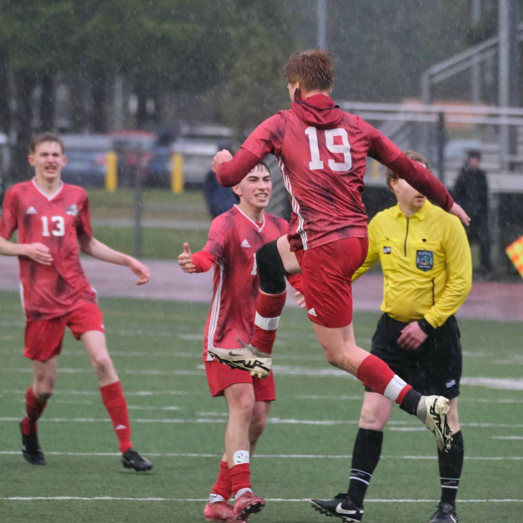 Juneau-Douglas High School: Yadaa.at Kalé senior defender Reed Maier (19) celebrates his goal against West Anchorage during the Crimson Bears 1-1 tie with the Eagles on Friday at Adair Kennedy Memorial Park. (Klas Stolpe / Juneau Empire)