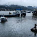 The fishing vessel Sentinel arrives for its blessing while the City of Juneau Pipe Band performs. (Jasz Garrett / Juneau Empire)