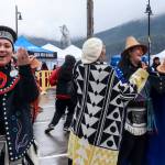 Donedin Jackson (center), who traveled from Alberta, Canada, is pulled from the audience into dance by her friend Davina Cole (left) at the Juneau Maritime Festival on Saturday, May 3, 2025. (Jasz Garrett / Juneau Empire)