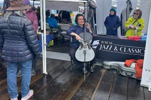 Zuill Bailey, artistic director for the Juneau Jazz and Classics festival, performs on cello during the Juneau Maritime Festival on Saturday. JJAC is among the organizations receiving a termination notice Friday of funding from the National Endowment for the Arts. (Mark Sabbatini / Juneau Empire)
