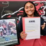 Juneau-Douglas High School: Yadaa.at Kalé senior Milina Mazon shows her Northwest Athletic Conference Letter of Intent on Monday in the JDHS commons to attend Edmonds College in Lynnwood, Washington, and play soccer for the Tritons. (Klas Stolpe / Juneau Empire)