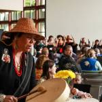 Kolene James, multicultural services manager at the Native and Rural Student Center, drums at the Alaska Native graduation ceremony at the University of Alaska Southeast on Sunday, May 4, 2025. (Jasz Garrett / Juneau Empire)