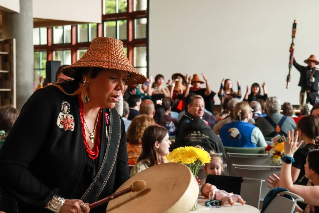 Kolene James, multicultural services manager at the Native and Rural Student Center, drums at the Alaska Native graduation ceremony at the University of Alaska Southeast on Sunday, May 4, 2025. (Jasz Garrett / Juneau Empire)