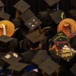 Woven cedar hats are seen amongst the black graduation caps at the annual University of Alaska Southeast commencement on Sunday, May 4, 2025. (Jasz Garrett / Juneau Empire)