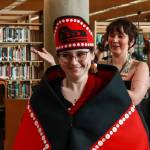 Carolyn Trebian, who graduated with a Bachelor of Liberal Arts in Alaska Native languages and studies, and Selah Judge, who graduated with a Bachelor of Arts in social sciences, dance at the University of Alaska Southeast Alaska Native graduation on Sunday, May 4, 2025. (Jasz Garrett / Juneau Empire)