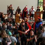 Woosh.Ji.Een dancers give gifts to graduates at the University of Alaska Southeast Alaska Native graduation ceremony on Sunday, May 4, 2025. (Jasz Garrett / Juneau Empire)