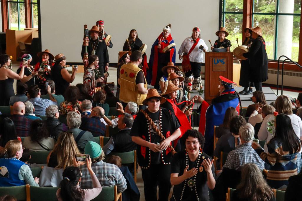 Woosh.Ji.Een dancers give gifts to graduates at the University of Alaska Southeast Alaska Native graduation ceremony on Sunday, May 4, 2025. (Jasz Garrett / Juneau Empire)