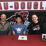 Juneau-Douglas High School: Yadaa.at Kaléenior Pedrin Saceda-Hurt signed an NCAA Division III student-athlete form on Wednesday in the JDHS commons to attend Luther College in Decorah, Iowa and play for the Norse basketball team. Shown are former Thunder Mountain coach John Blasco, Pedrin Saceda-Hurt and JDHS coach Robert Casperson. (Klas Stolpe/Juneau Empire)