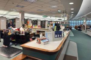 Staff at the Juneau Public Librarys downtown branch sort materials on Thursday, May 8, 2025. (Mark Sabbatini / Juneau Empire)