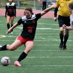 Juneau-Douglas High School: Yadaa.at Kalé freshman Ayla Erickson takes a shot under pressure from Soldotna senior Anika Jedlicka (19) during the Crimson Bears 2-1 loss to the Stars on Thursday at Adair Kennedy Memorial Park. (Klas Stolpe/ Juneau Empire)