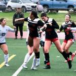 Juneau-Douglas High School: Yadaa.at Kalé junior Kenzie Simonson (7) heads a shot as senior Milina Mazon (11), freshman Ayla Erickson (16) and Soldotna freshman Mykah Walgenbach (22) and sophomore Teagen Kobylarz (2) react during the Crimson Bears 2-1 loss to the Stars on Thursday at Adair Kennedy Memorial Park. (Klas Stolpe/ Juneau Empire)