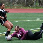 Juneau-Douglas High School: Yadaa.at Kalé senior Milina Mazon slips a shot past Soldotna sophomore keeper Ryan Queen (55) during the Crimson Bears 2-1 loss to the Stars on Thursday at Adair Kennedy Memorial Park. JDHS was ruled offside and the goal was disallowed. (Klas Stolpe/ Juneau Empire)