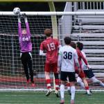 Juneau-Douglas High School: Yadaa.at Kalé freshman keeper Callen Walker tips a Soldotna shot over the crossbar during the Crimson Bears 3-0 win over the Stars on Thursday at Adair Kennedy Memorial Park. (Klas Stolpe / Juneau Empire)