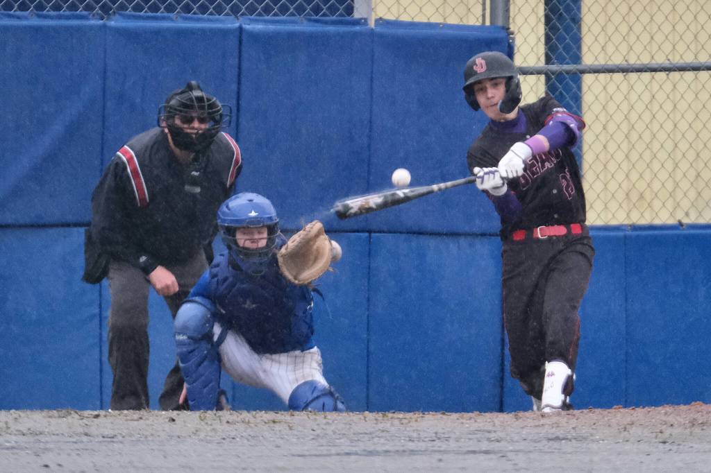 Juneau-Douglas High School: Yadaa.at Kalé junior Chris Andersen connects on a pitch during the Crimson Bears 12-7 win over the Petersburg Vikings on Friday at Mort Fryer Ball Park in Petersburg. (Klas Stolpe / Juneau Empire)