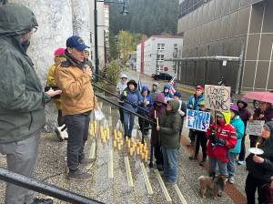 State Sen. Forrest Dunbar (D-Anchorage) speaks during a candlelight vigil Wednesday at the Alaska State Capitol by participants calling upon federal lawmakers not to cut Medicaid funding (Mark Sabbatini / Juneau Empire)
