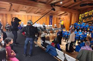 Axel Baumann films and Max Osadchenko captures sounds of Juneau Alaska Music Matters students performing a Gratitude concert at the Sealaska Heritage Institute Clan House on Thursday, May 8, 2025. The event was a wrapup performance after the film crew followed JAMM participants for two weeks as part of a feature-length documentary. (Mark Sabbatini / Juneau Empire)