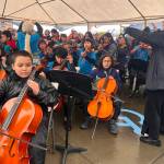 Juneau Alaska Music Matters Students perform at the Juneau Maritime Festival on Saturday, May 3, 2025. The performance was among many captured by a film crew for an upcoming documentary featuring the music program. (Mark Sabbatini / Juneau Empire)