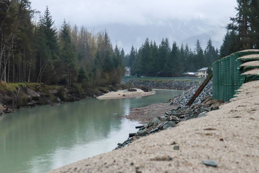 HESCO barriers line the Mendenhall River on Monday, May 12, 2025. (Jasz Garrett / Juneau Empire)