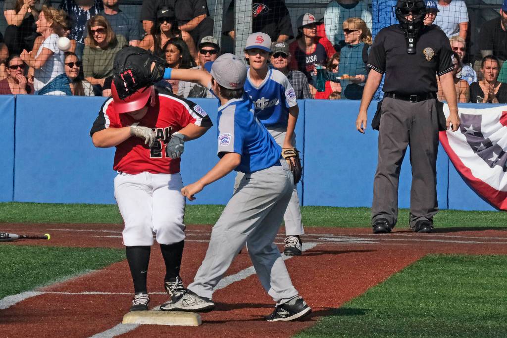 In this file photo Sitka first baseman Caleb Calhoun catches a throw to put out Juneaus Gastineau Channel LL batter Marcus Mendoza (22) during the 2019 Little League Alaska District 2 Majors Baseball championship game at Sitkas Moller Field. Sitka went on to host and defeat Eagle Rivers Knik LL in a best 3-out-of-5 series for the State title and a trip to the Northwest Region in San Bernardino, California. (Klas Stolpe / Juneau Empire)