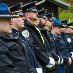 Juneau law enforcement officers stand in formation while Alaska Wildlife Trooper Sgt. Branden Forst reads the names of Southeast Alaskas fallen officers on Friday, May 16, 2025. (Jasz Garrett / Juneau Empire)
