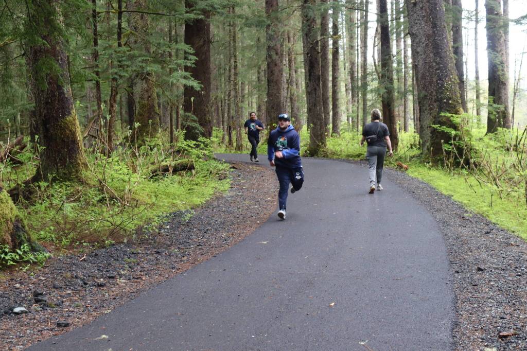 Runners approach the final stretch of the 5K Alaska Law Enforcement Torch Run on Saturday, May 17, 2025. (Ellie Ruel / Juneau Empire)