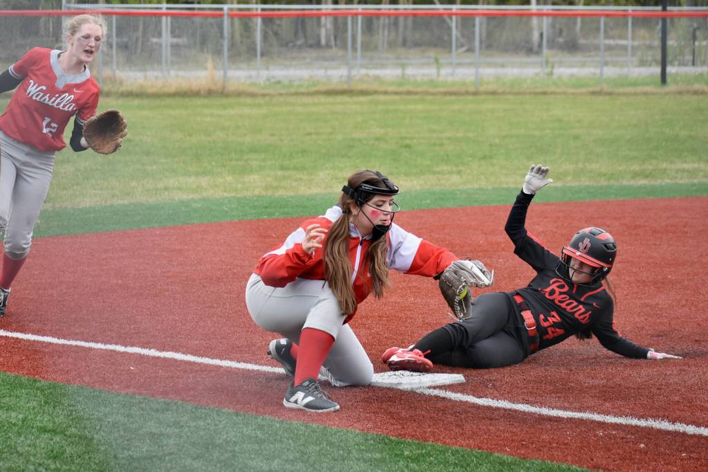 Juneau-Douglas High School: Yadaa.at Kalé sophomore Taylor Petrie slides into third base against Wasilla during the Crimson Bears 18-0 win over the Warriors on Friday at Wasilla. (Photo courtesy JDHS softball)