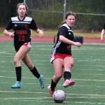 Juneau-Douglas High School: Yadaa.at Kalé freshman Marigold Lindoff (22), freshman Ayla Erickson (16) and senior Natalie Travis (10) are shown in action last week against Soldotna at Adair Kennedy Memorial Park. (Klas Stolpe / Juneau Empire file photo)