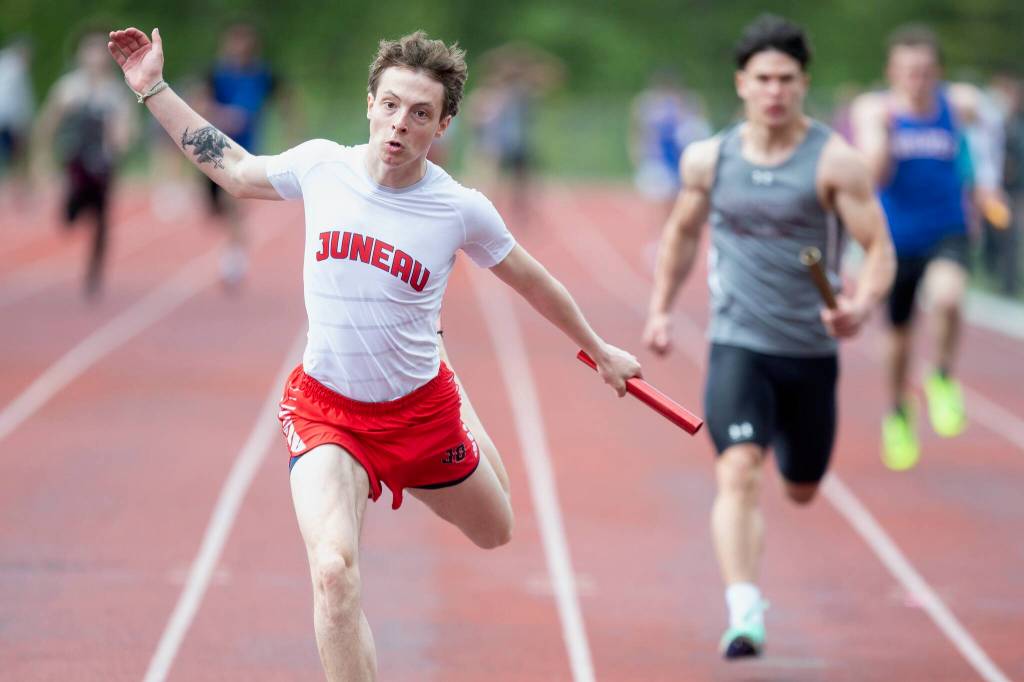Juneau-Douglas High School: Yadaa.at Kalés Carter Harralston crosses the finish line of the boys 4x100 meter relay during the Ketchikan Invitational at Esther Shea Field on Saturday. The relay team, comprised of Orion Paden, Finley Hightower, Johnathyn Kestel and Carter Harralston, won the event with a time of 44.81. (Christopher Mullen/ Ketchikan Daily News)