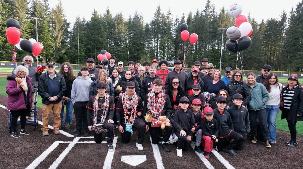 Juneau-Douglas High School: Yadaa.at Kalé seniors Jacob Katasse, JJ McCormick and Christian Nelson and their families were honored during the Crimson Bears baseball senior night against Ketchikan Saturday at Adair-Kennedy Memorial Park. (Klas Stolpe / Juneau Empire)