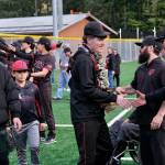 Juneau-Douglas High School: Yadaa.at Kalé senior Christian Nelson shakes hands with coaches during the Crimson Bears’ baseball senior night against Ketchikan on Saturday at Adair-Kennedy Memorial Park. (Klas Stolpe / Juneau Empire)