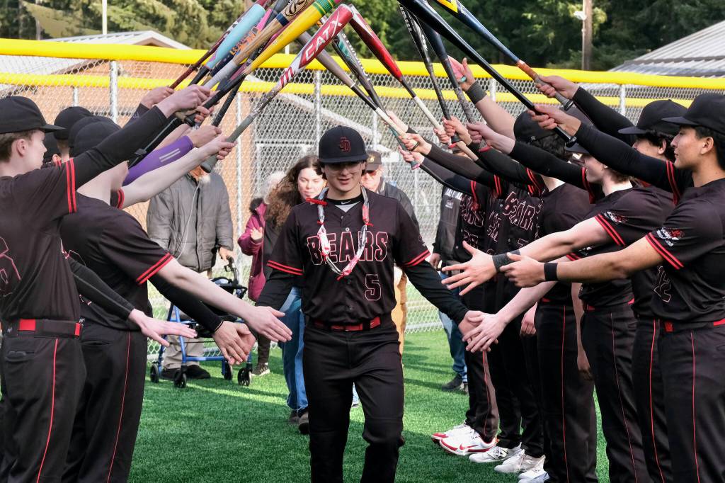 Juneau-Douglas High School: Yadaa.at Kalé senior Jacob Katasse is honored during the Crimson Bears’ baseball senior night against Ketchikan on Saturday at Adair-Kennedy Memorial Park. (Klas Stolpe / Juneau Empire)