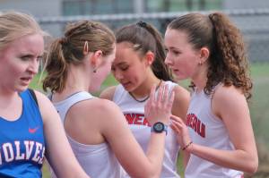 Juneau-Douglas High School: Yadaa.at Kalé junior distance runners Della Mearig and Lua Mangaccat and freshman Sunna Schane congratulate each other during an event at the Capital City Classic this year. The Region V Track & Field championships are Friday and Saturday at Thunder Mountain Middle School. (Klas Stolpe / Juneau Empire)